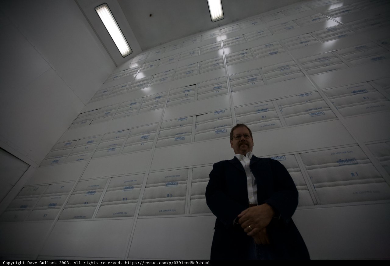 Executive in front of Box Wall