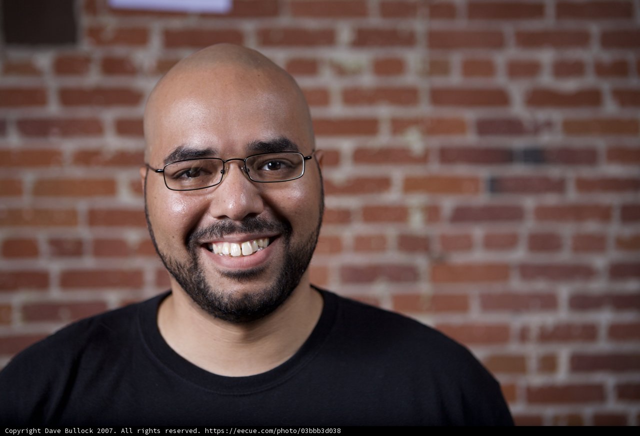 Smiling Bald Man in Glasses