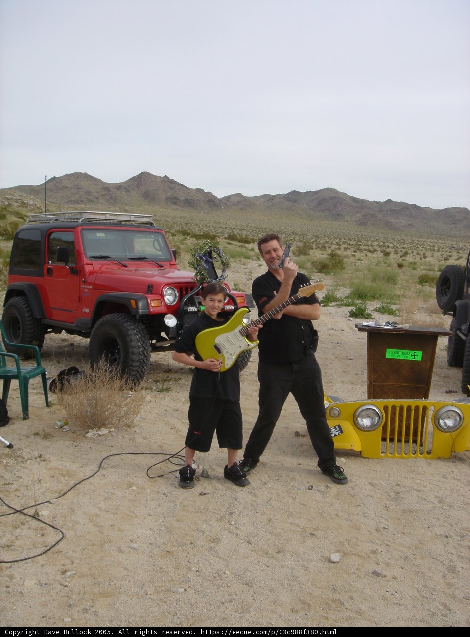 Father and Son Take a Break to Jam in the Desert