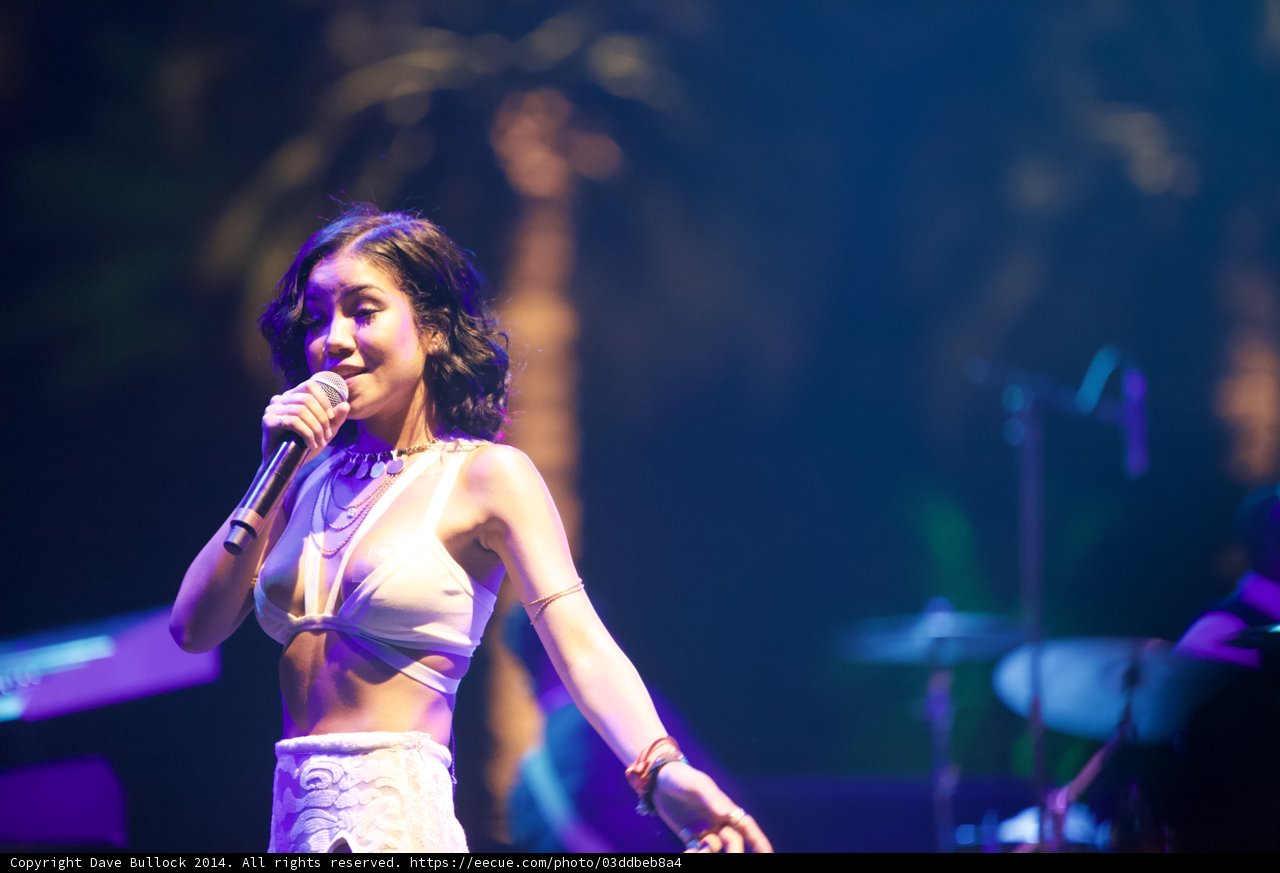 Jhené Aiko Solo Performance Caption: Entertainer Jhené Aiko electrifying the crowd with her powerful voice during a solo performance at Coachella 2014.
