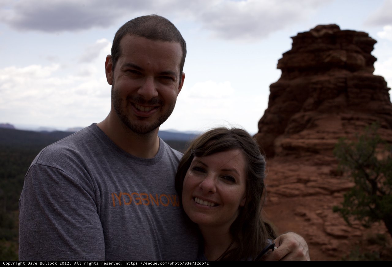 Couple Smiling Atop Sedona's Red Rock Formations