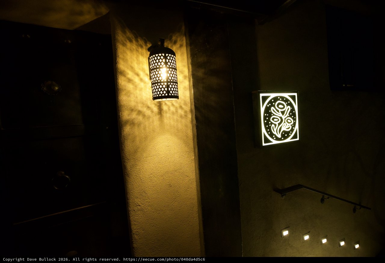 Moroccan-Inspired Lantern Casting Shadows in Dark Corridor