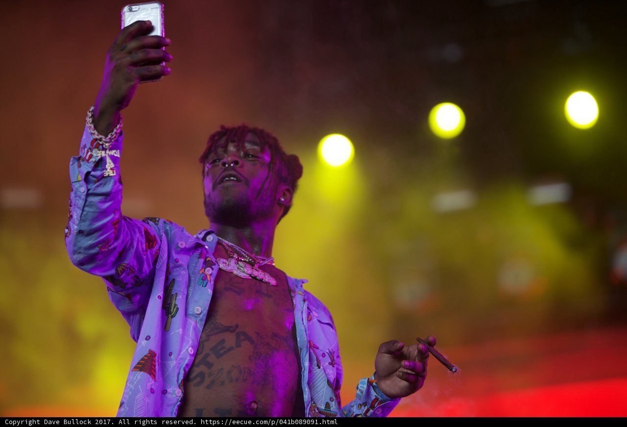 Tattooed Man Takes Over Coachella with Cell Phone