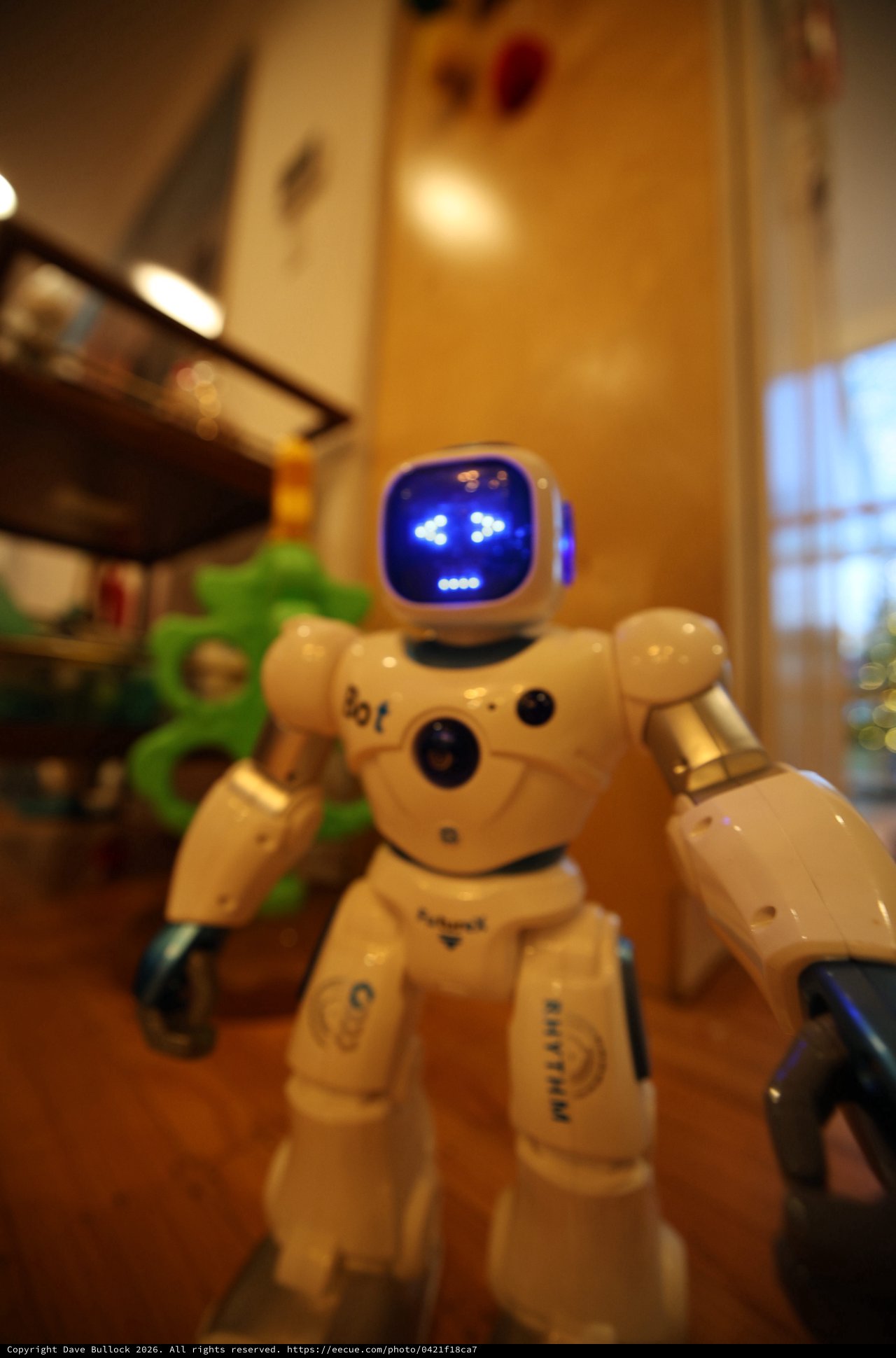 Small White Robot Toy with Blue Digital Face Display