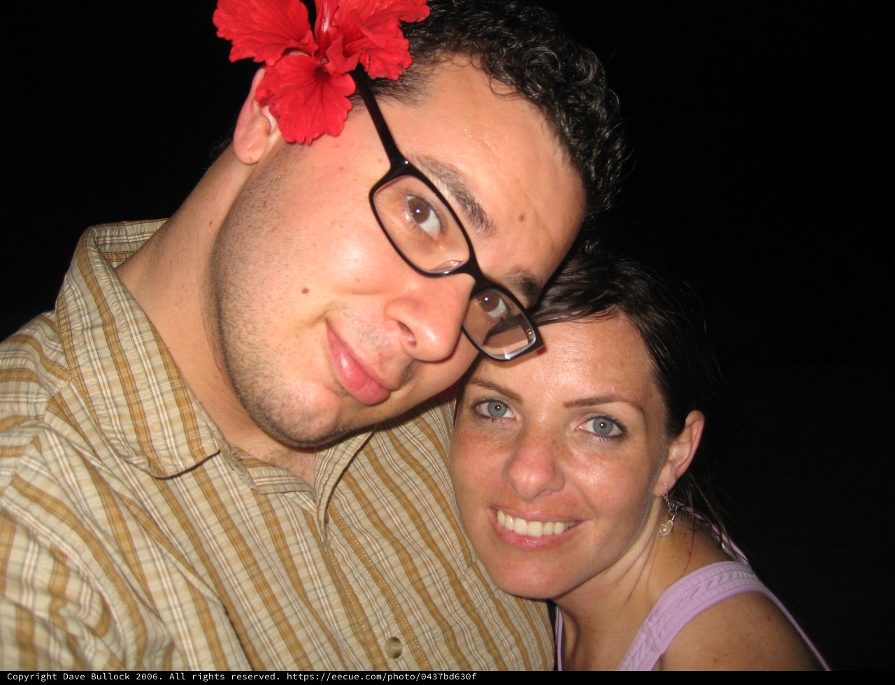 Couple Poses Together with Hibiscus Flower in Fiji