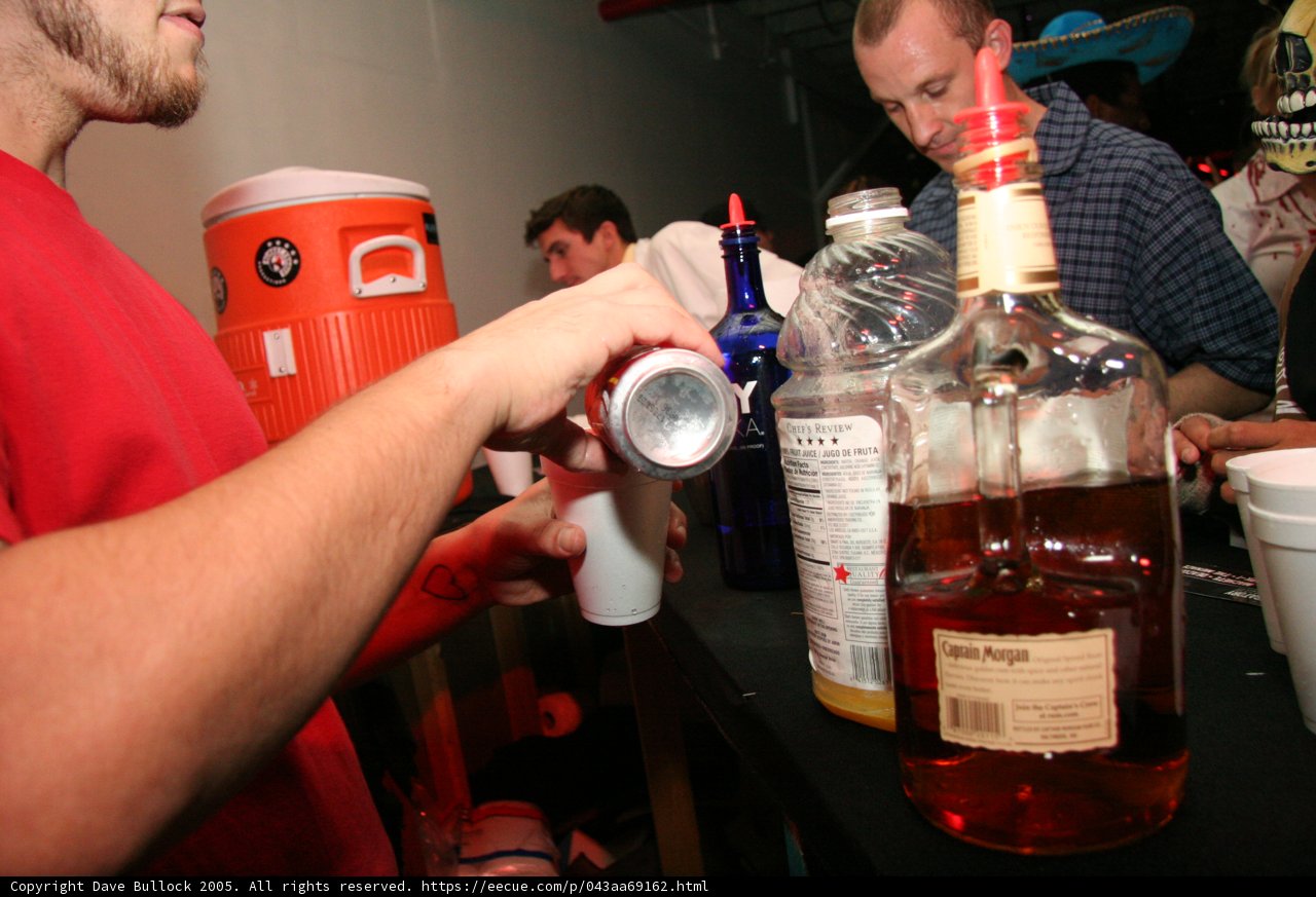 Red Shirted Man Enjoys a Beer at the Pub