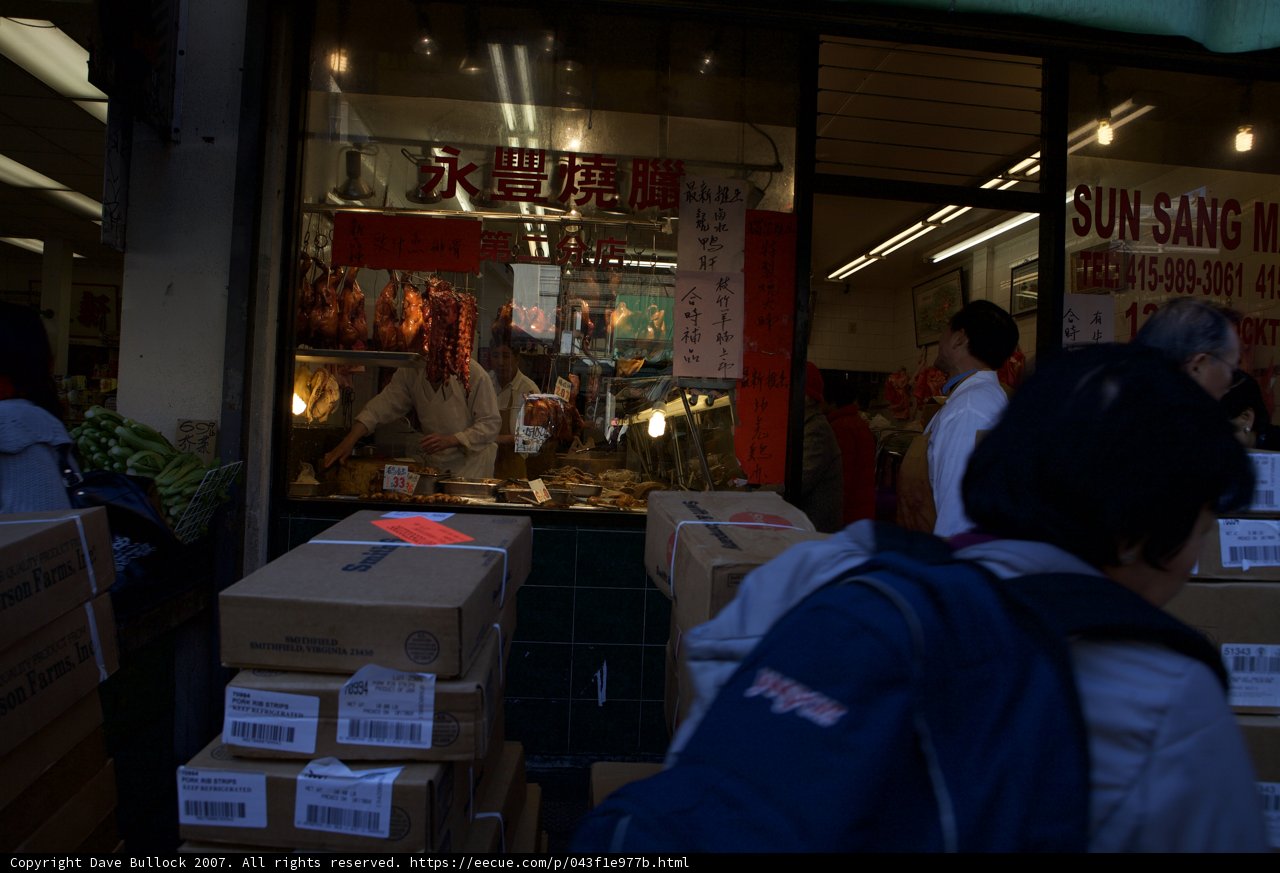 Street Vendor with Backpack and Carton Boxes