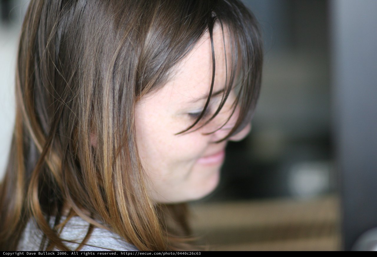 Windswept Hair Frames a Quiet Moment of Reflection