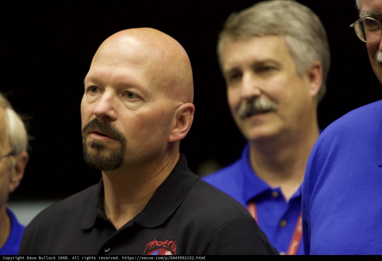 Bald Man with a Mustache in the Spotlight