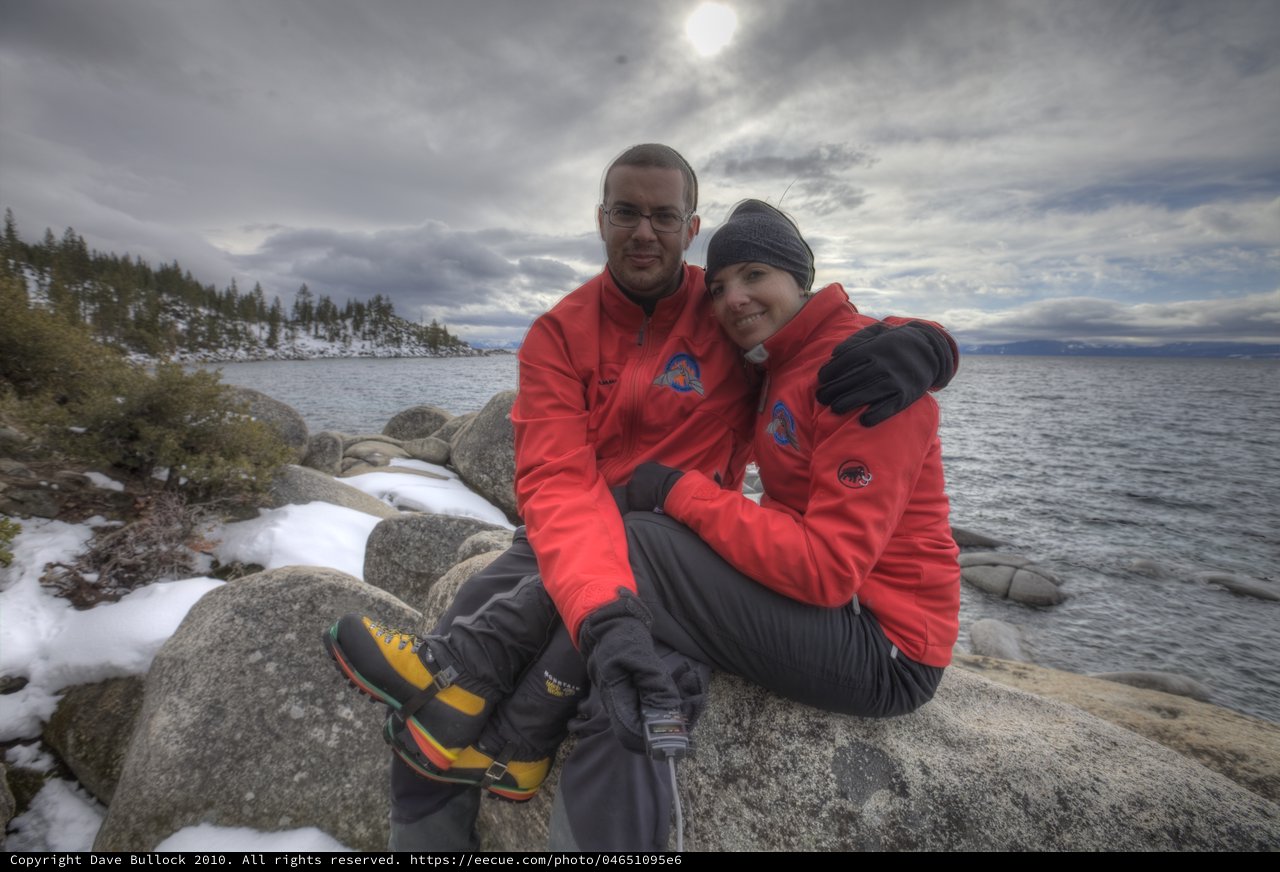 Couple Embracing at Snowy Lake Tahoe Shore