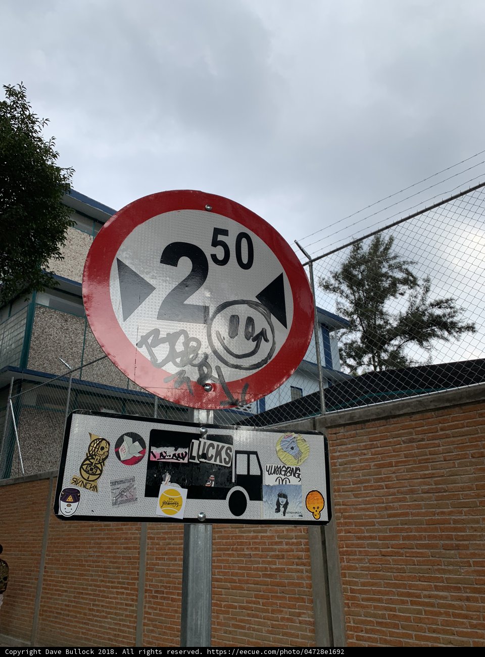 Stickered Street Sign