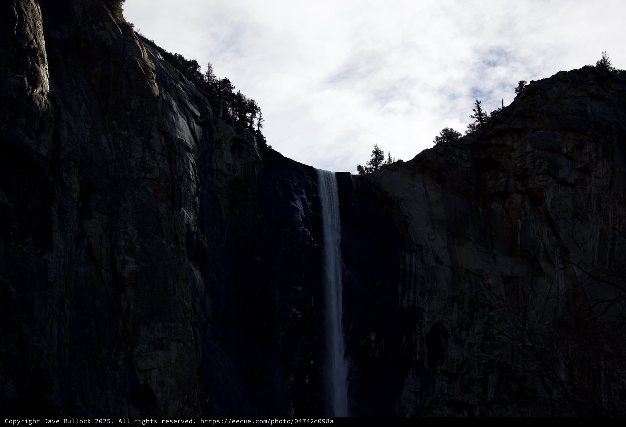 Waterfall Through Shadowed Granite Cliffs in Yosemite