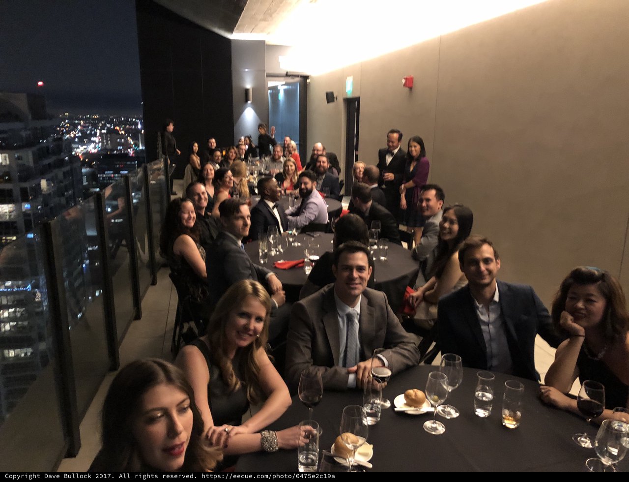 Elegant Rooftop Gala with City Lights Backdrop