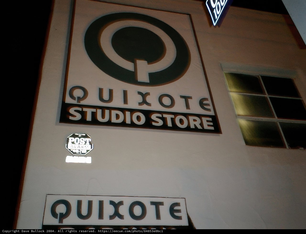 Quixote Studio Store Sign at Night