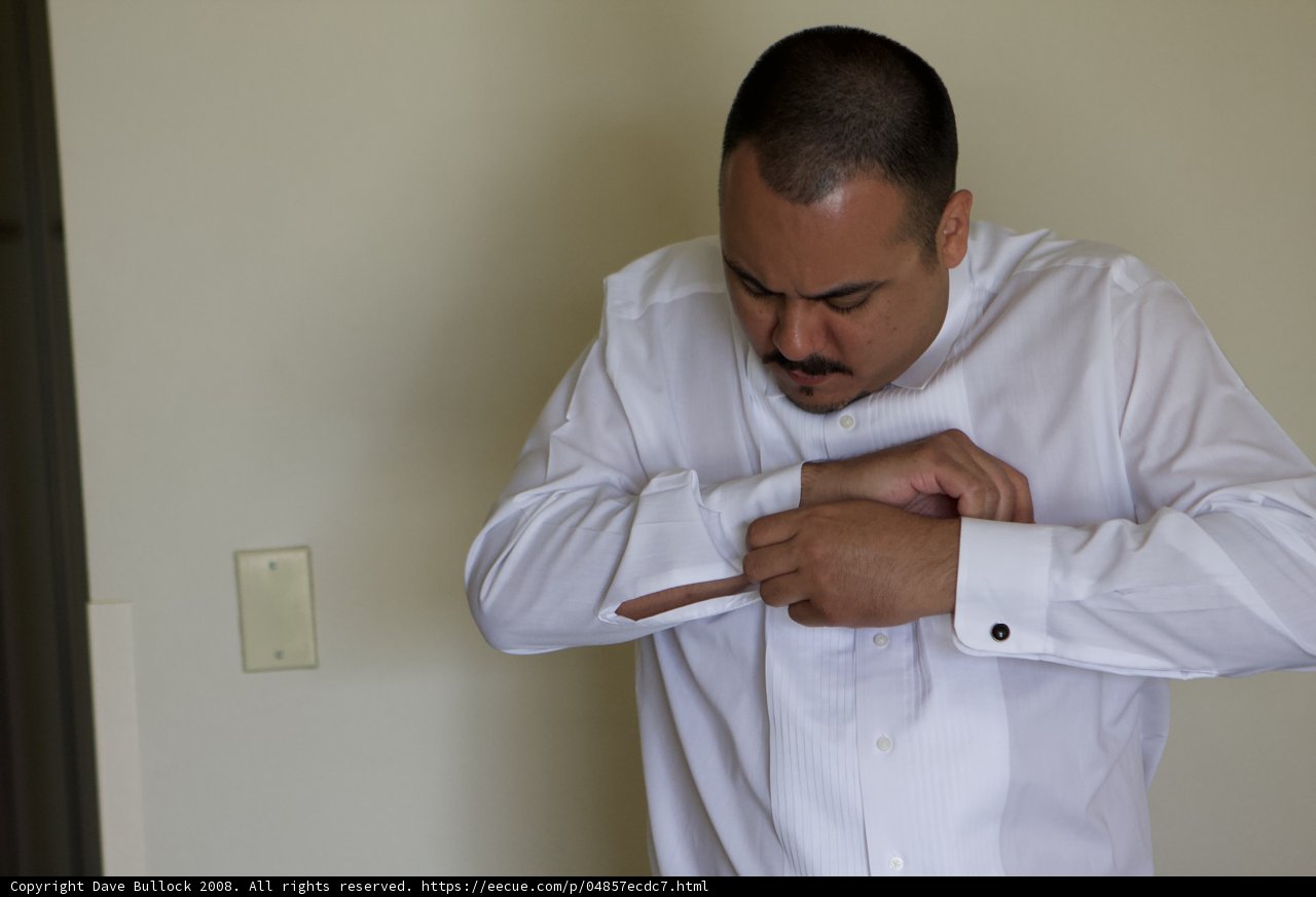 Adjusting his Dress Shirt