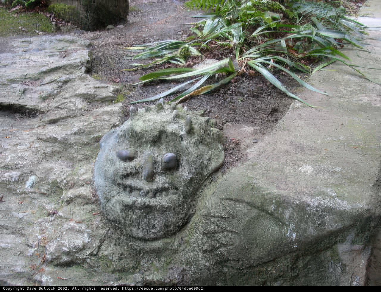 Sculpted Stone Face in Garden