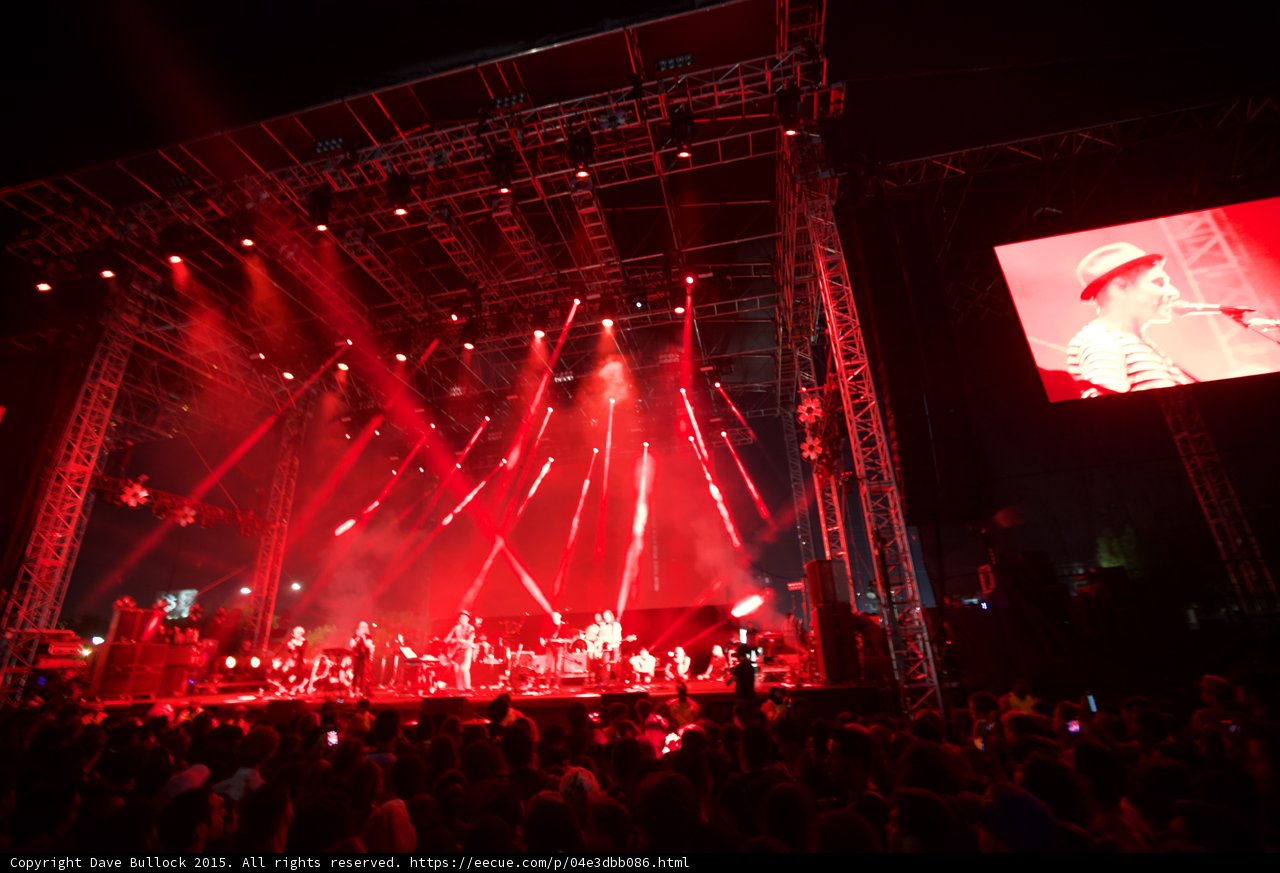Belle and Sebastian Wide Stage Red Lighting Video Screen Stuart Murdoch Spotlight Beams Finale