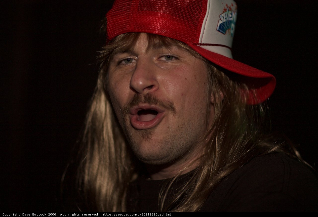 Long-Haired Man in a Baseball Cap