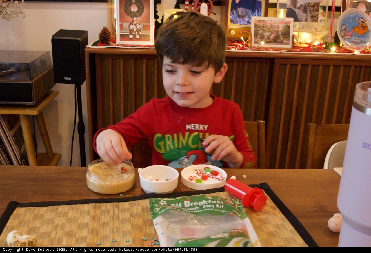 Young Boy Making Christmas Grinch Play Dough Creation