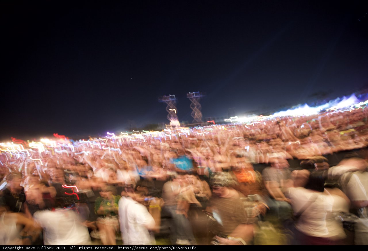 Blurry Nighttime Concert Crowd