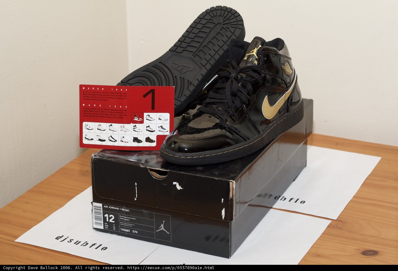 Black and Gold Sneakers on a Box