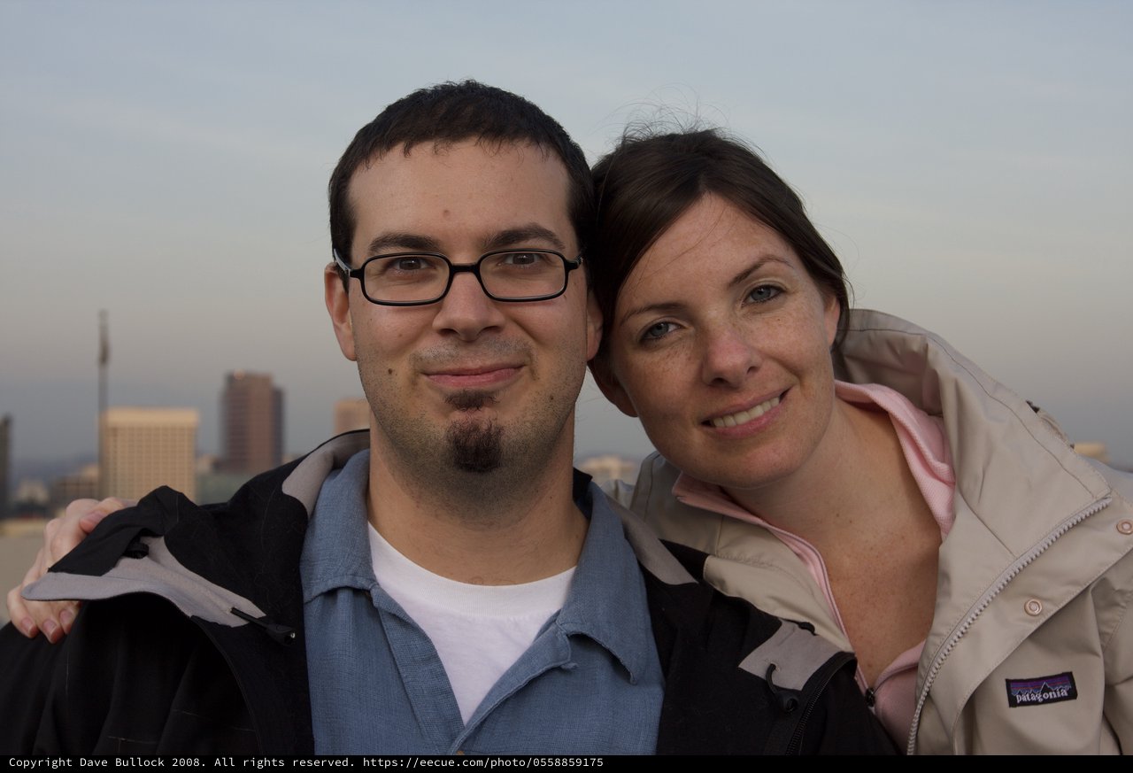 Couple Smiling Together Against City Skyline