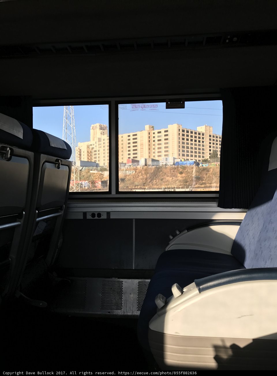 A Cityscape From A Train Car