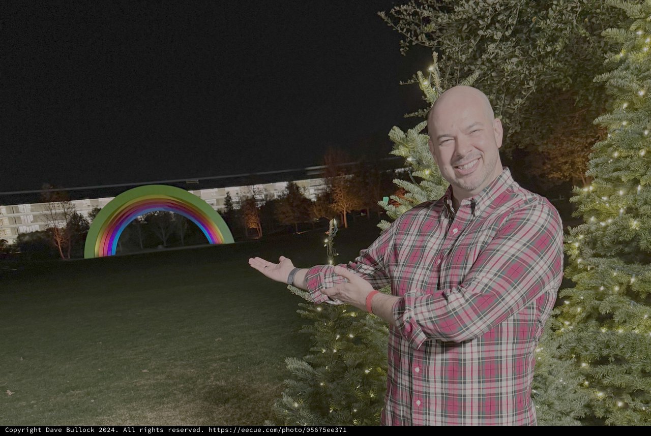 Man Presents Holiday Rainbow Display at Night