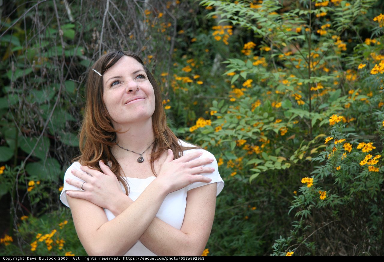 Dreaming Woman Among Golden Wildflowers in Nature