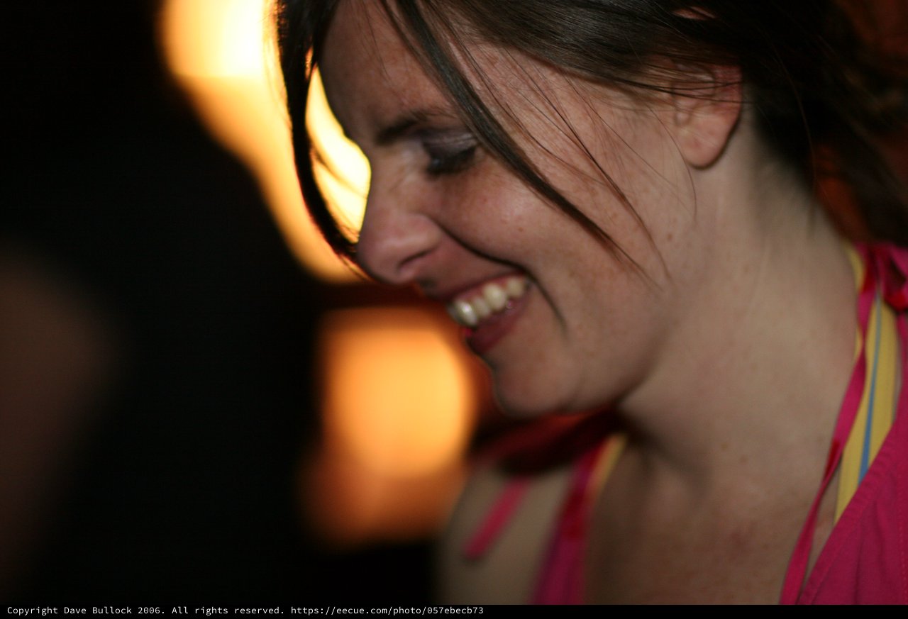 Laughing Woman Glowing in Warm Party Light