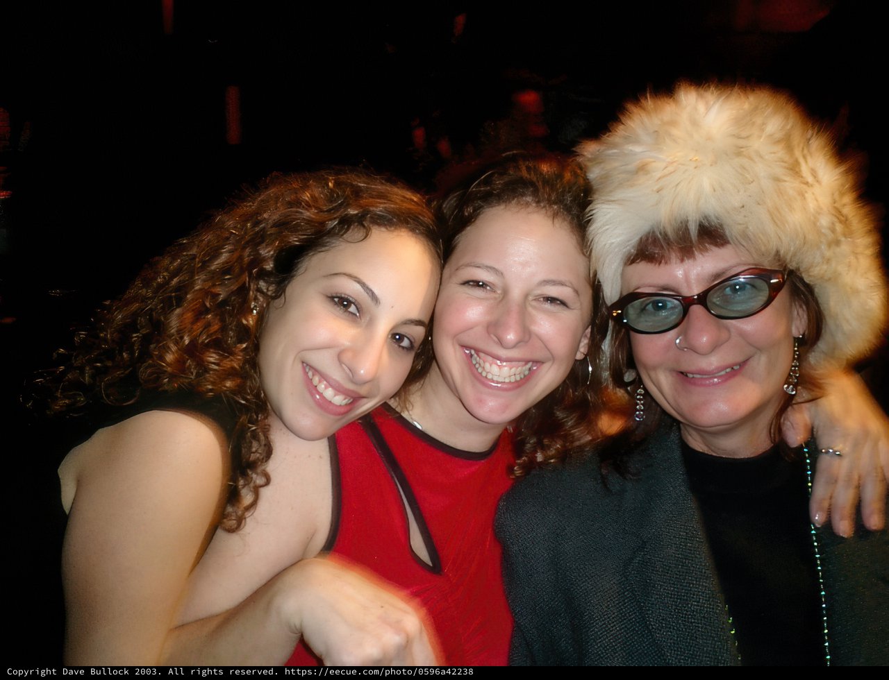 Three Fashionable Women Strike a Pose