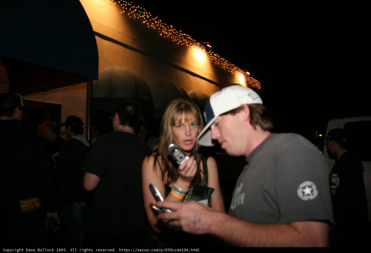 Couple at the Nightclub with Baseball Caps