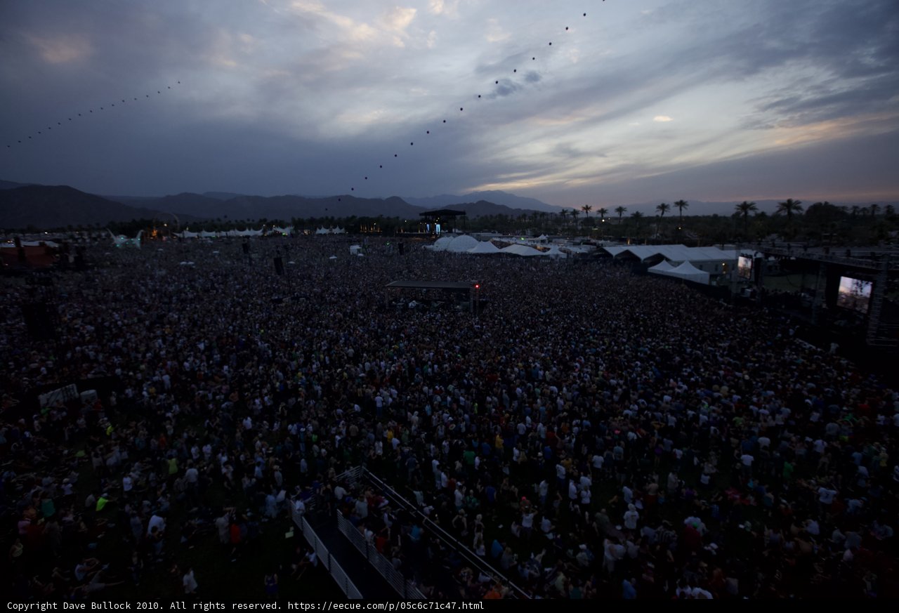 A Sea of Music Lovers with Mountainous Backdrop