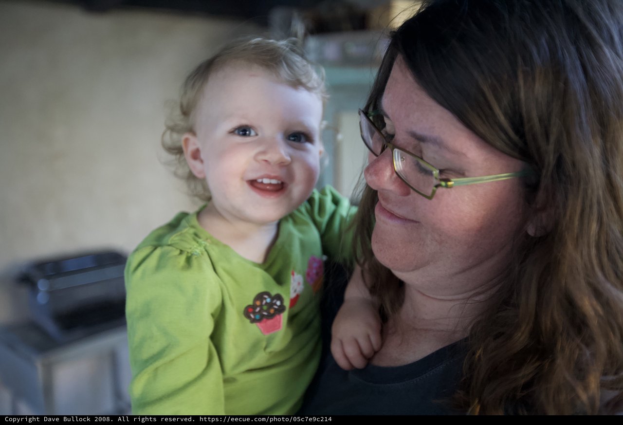 Joyful Toddler Smiles with Loving Mother Indoors