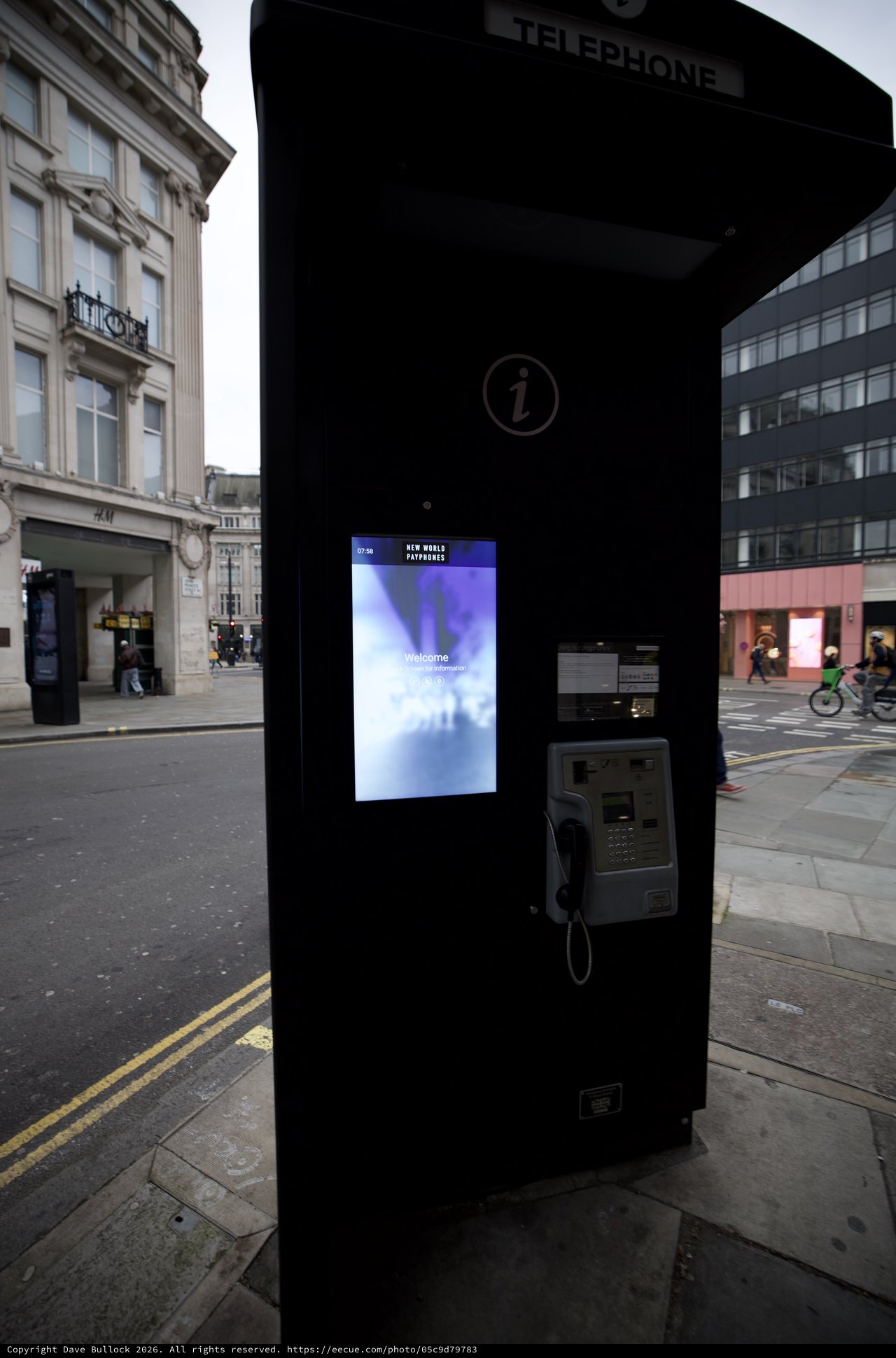 Modern Phone Booth with Digital Screen in London Street