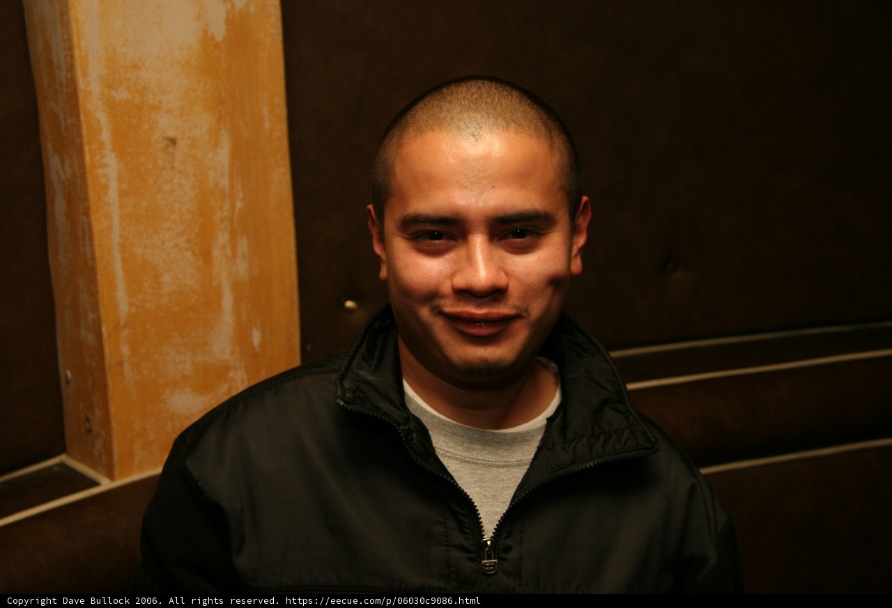 Smiling Monk in Black Jacket