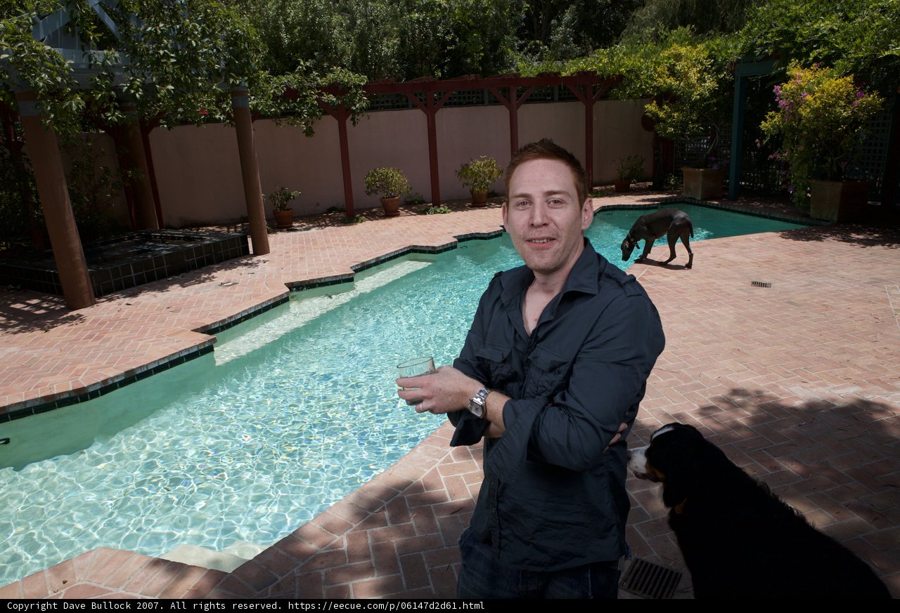 Man and Dog by the Pool
