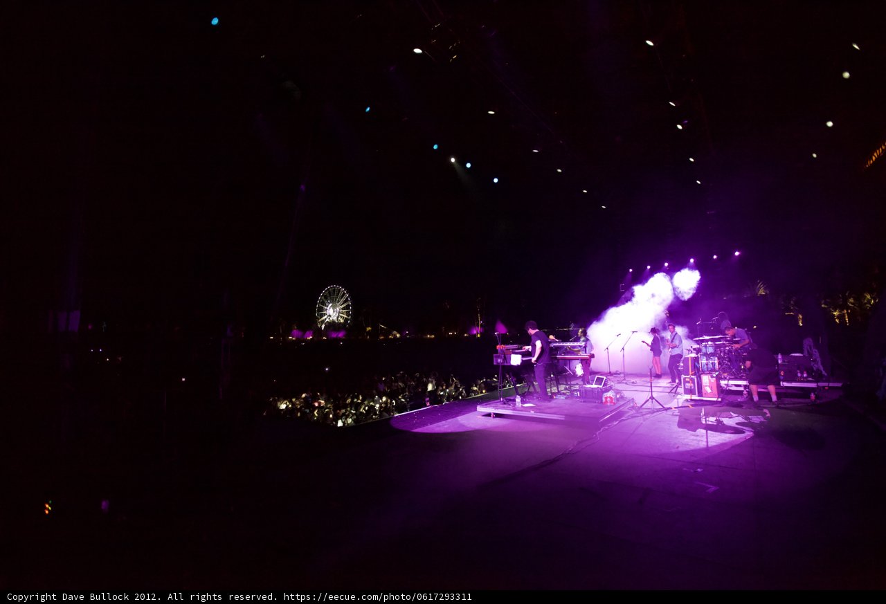 Nighttime Rock Concert Under Purple Lights