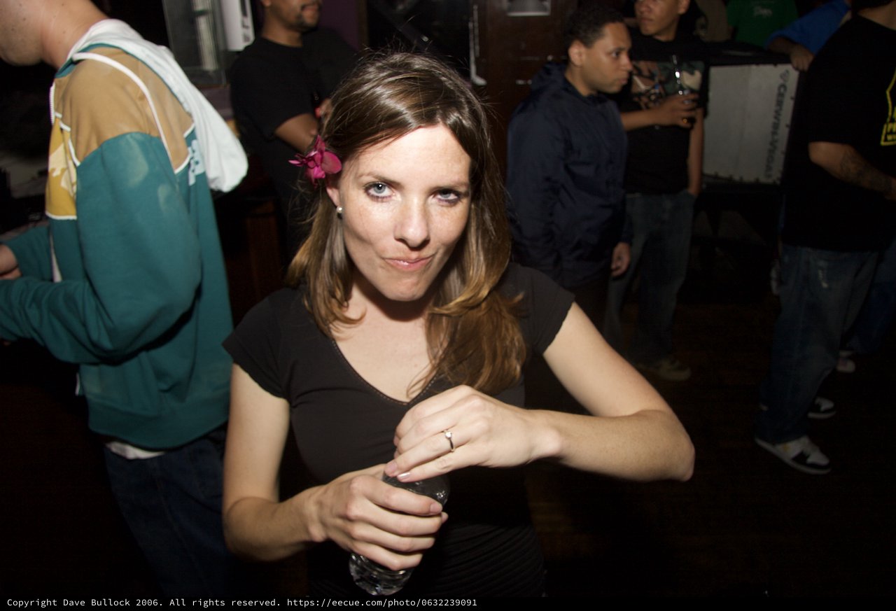Woman With Flower in Hair at Nightclub Party