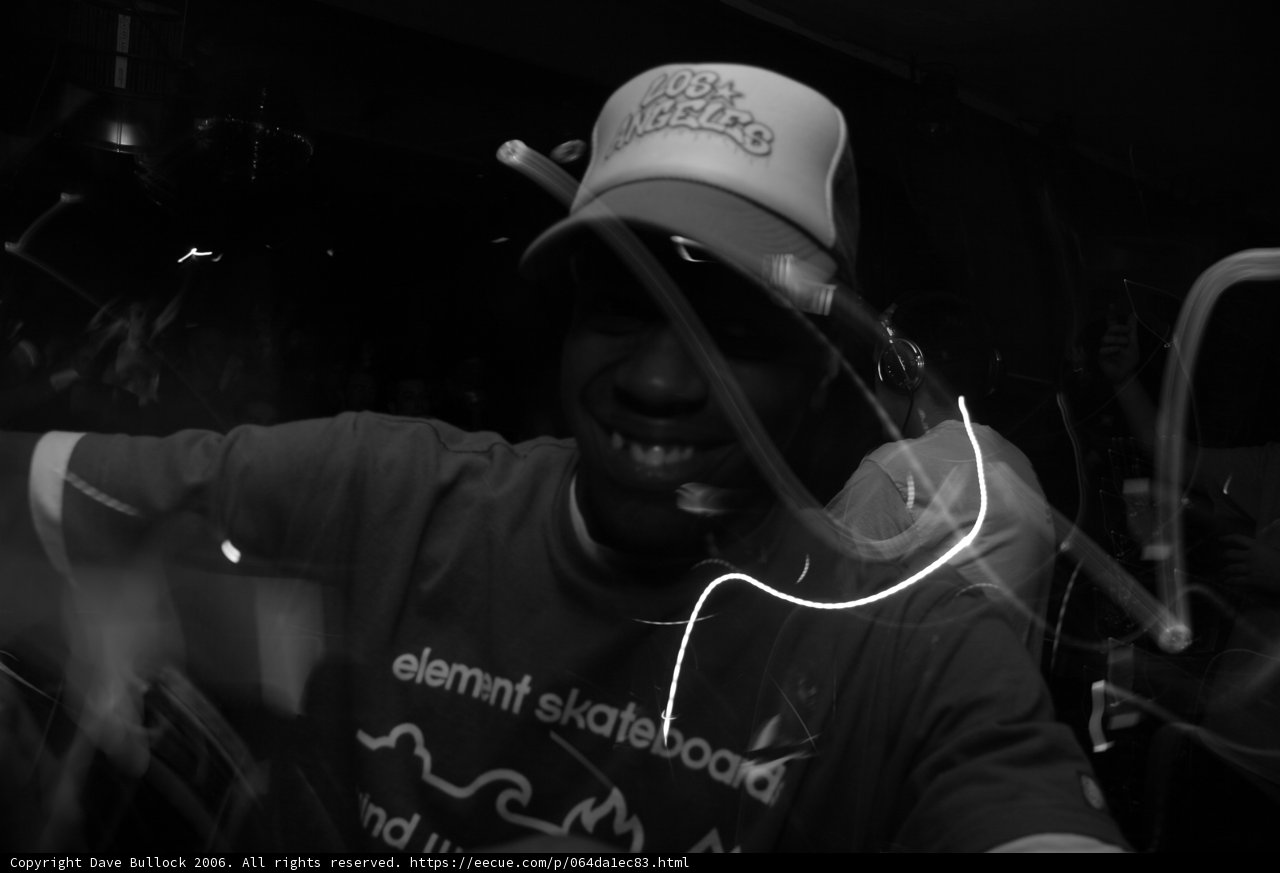 Man in Hat holding Microphone