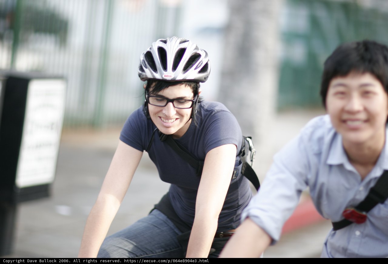 Woman wearing a blue shirt and Helmet