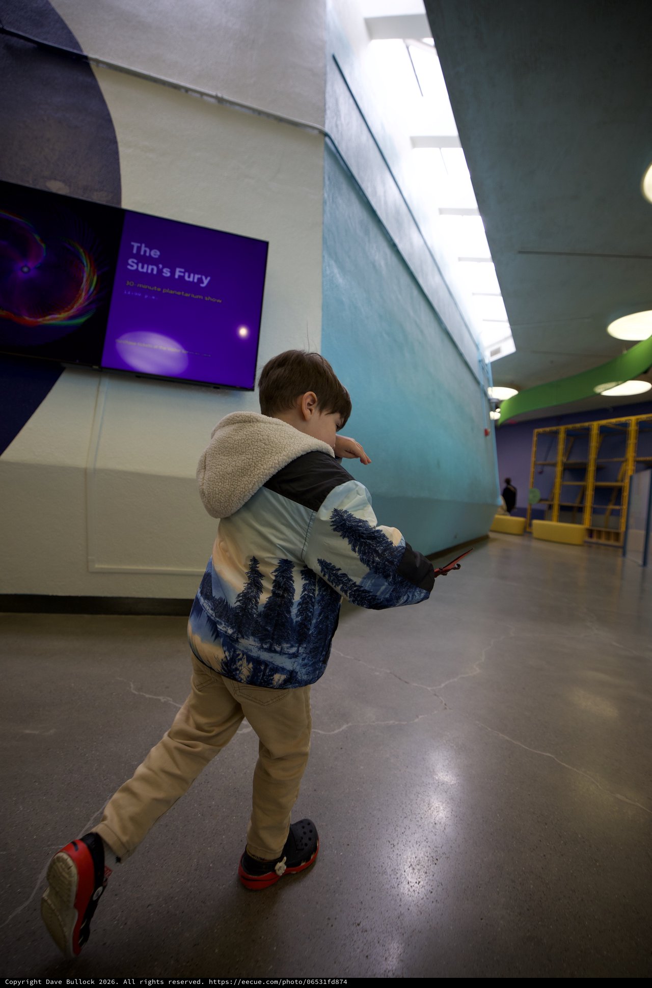 Young Boy Explores Museum with Winter Nature Jacket