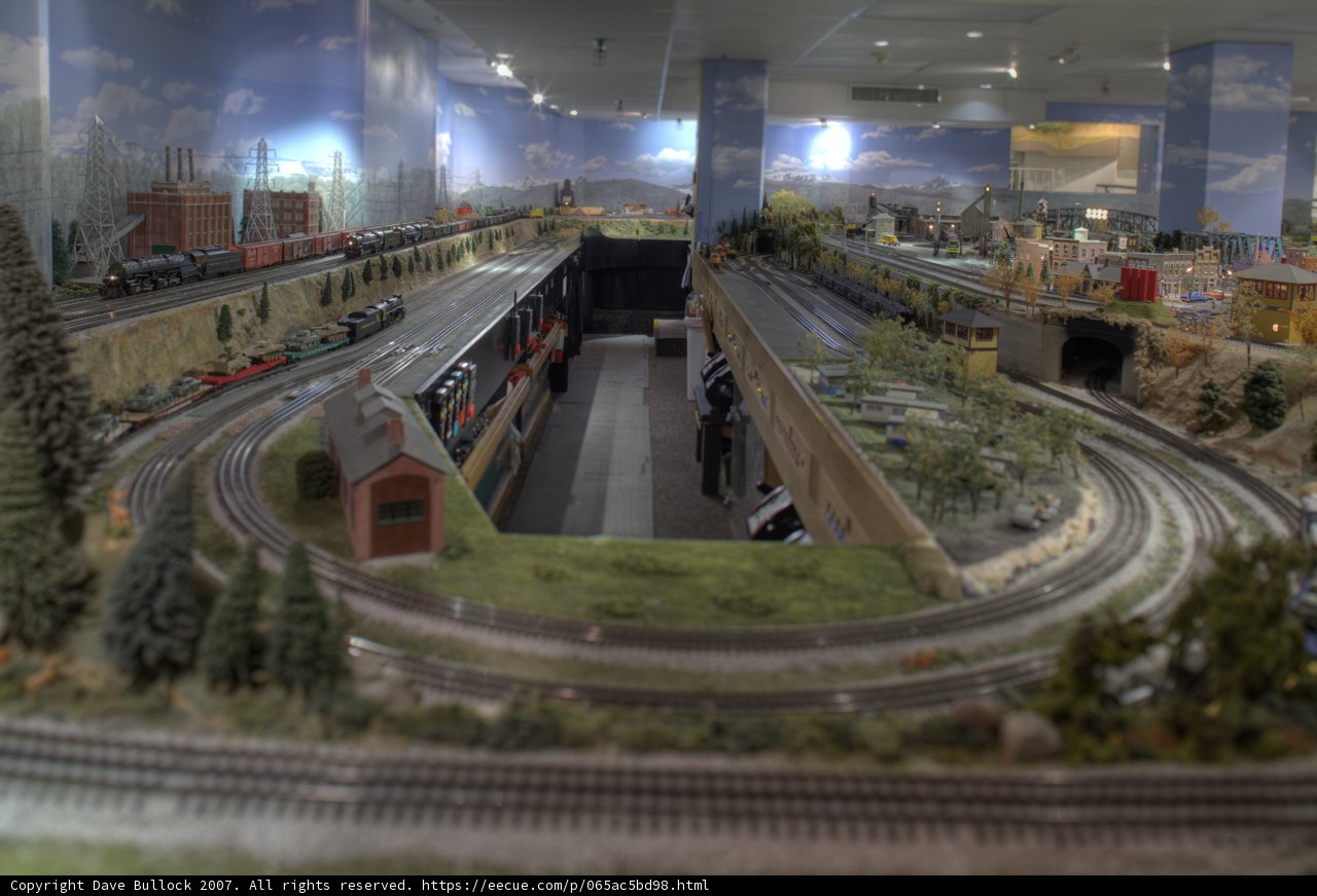 Miniature Train Journey through a Cityscape