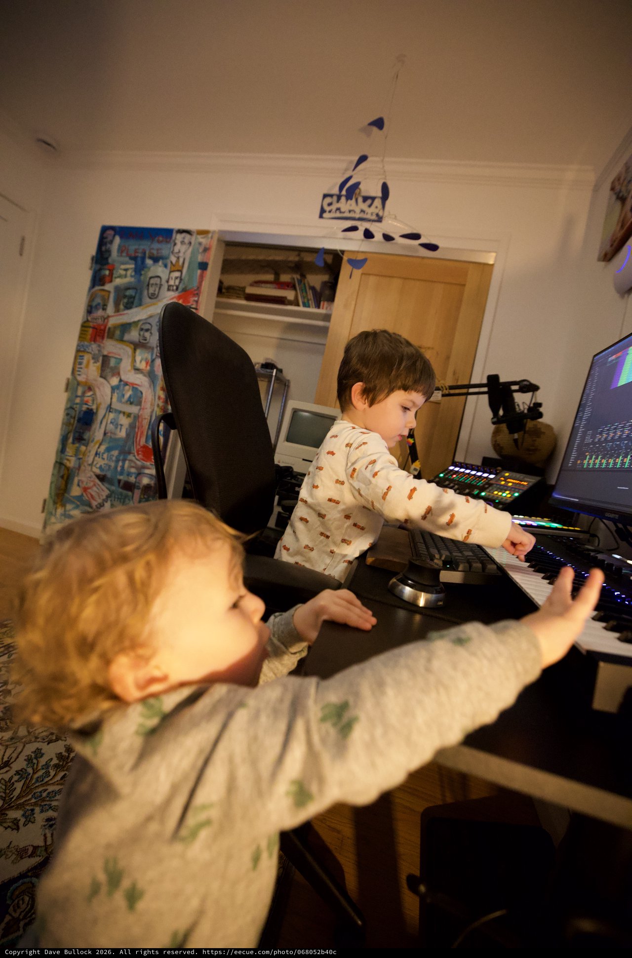 Young Brothers Making Music Together at Night