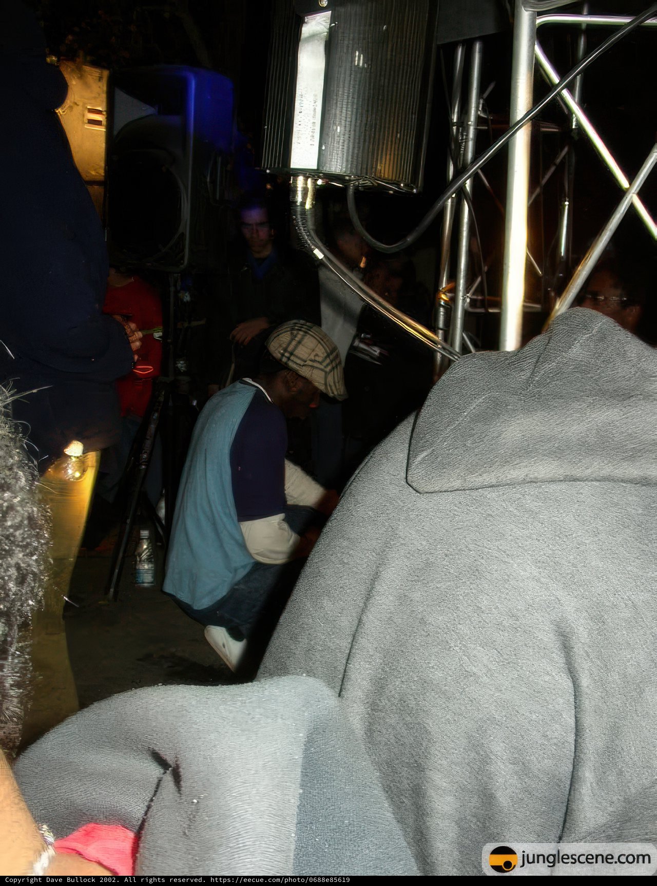 Urban Musician Holding a Mic on a Night Club Stage