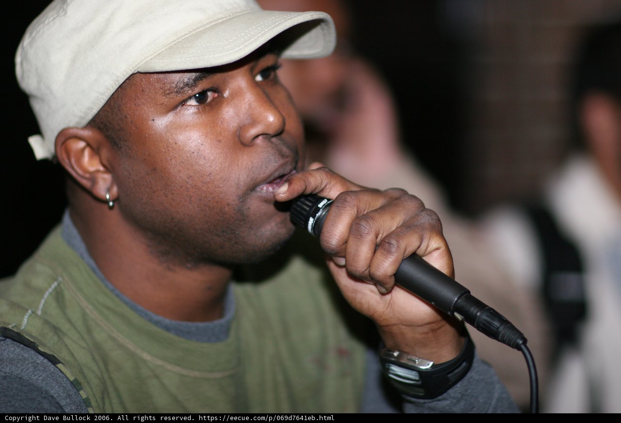 Steve J Performing with Green Shirt and Mic