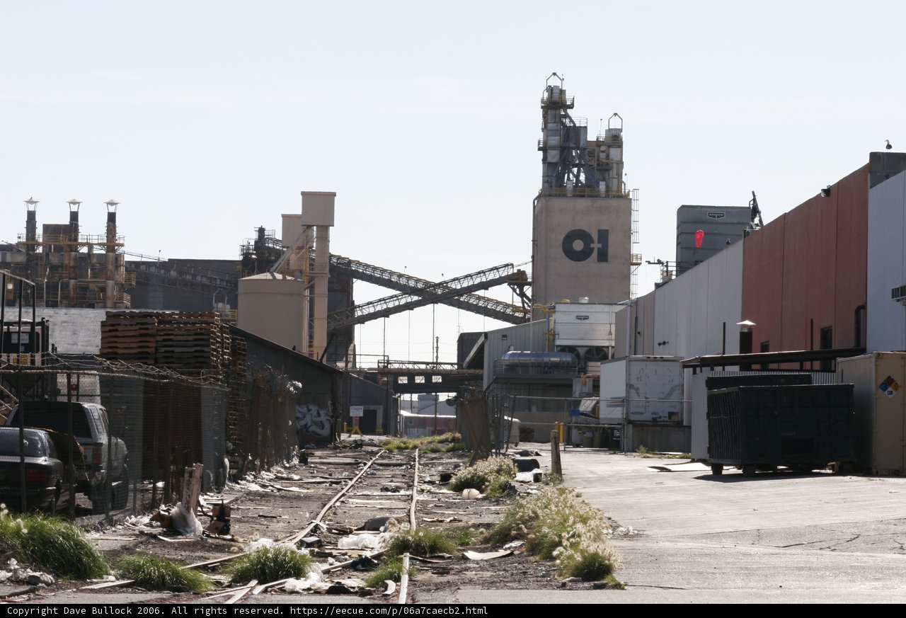 Skyline View of a Clock Tower and Factory