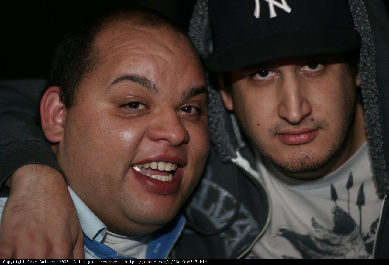 Two Men Sporting Baseball Caps