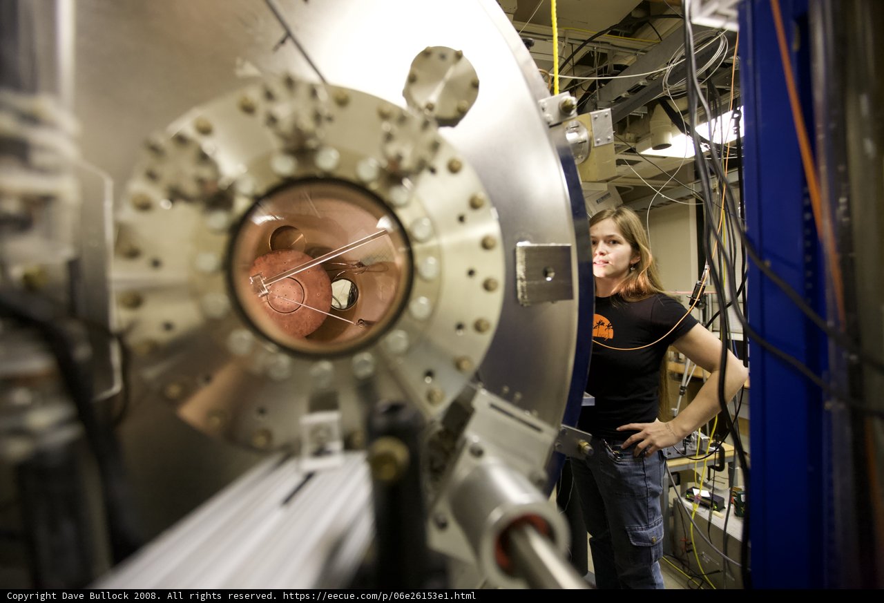 Woman Operating Large Machine in Factory