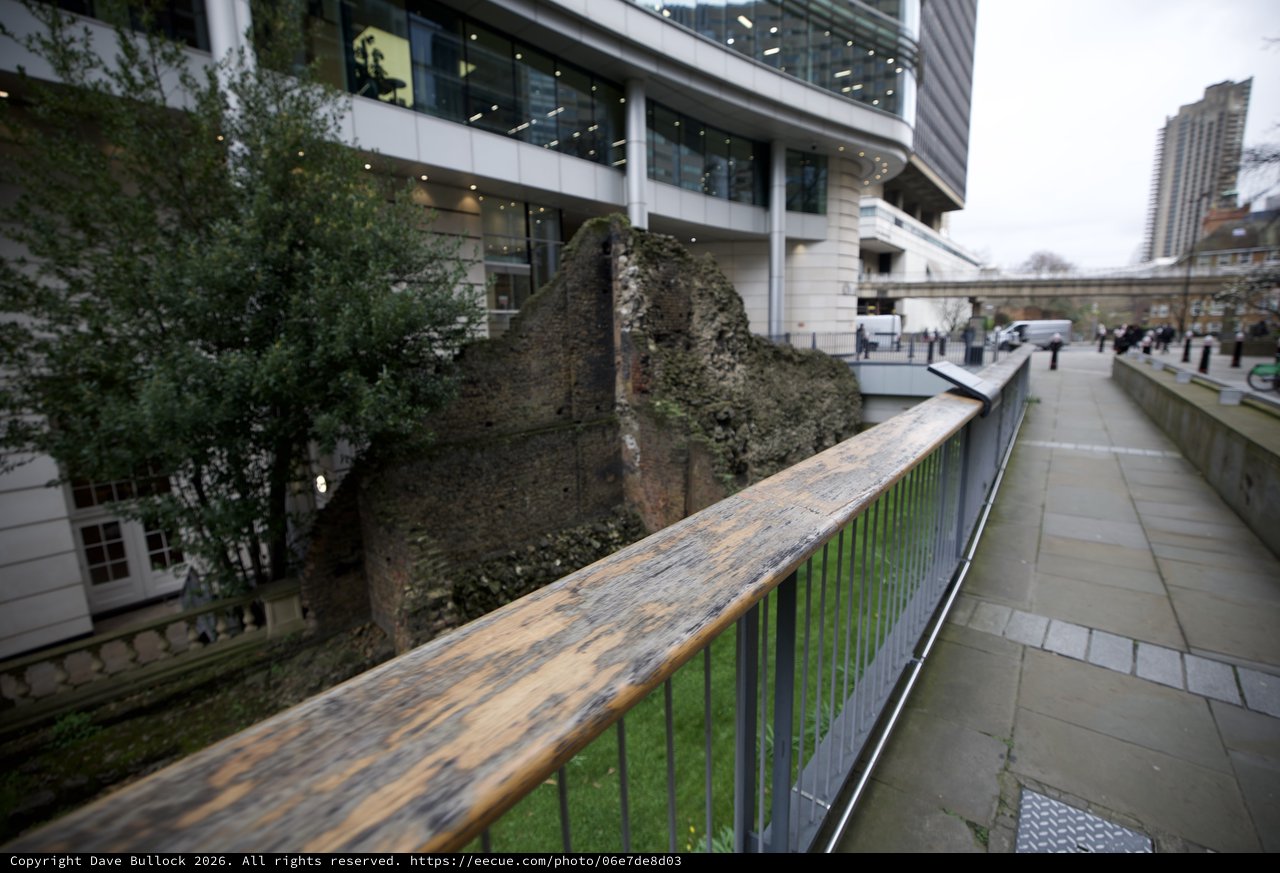 Ancient Roman Wall Ruins Amid Modern London Architecture